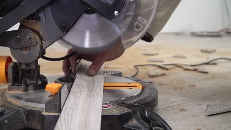 miter saw, electric power carpentry tools. cutting batten for laminate floor