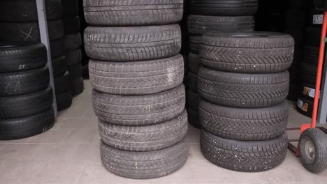 stacks of used tires in a warehouse