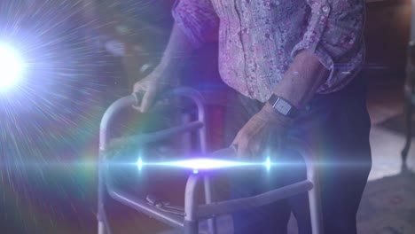 animation of light moving over midsection of senior woman using walking frame