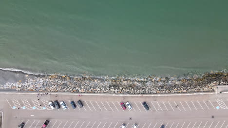 aerial descent over parking lot and sea wall, nantasket beach, ma