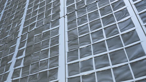 modern art installation of silver cloth panels blowing in the wind.