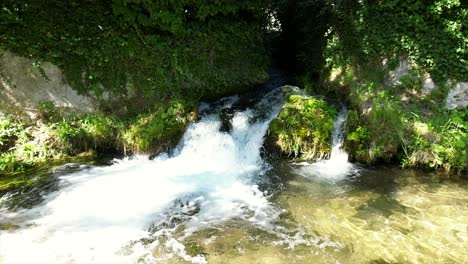 rural waterfall gushing in village town rasiglia