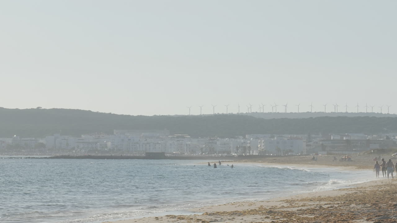 Beach with Wind Turbines in the Background
