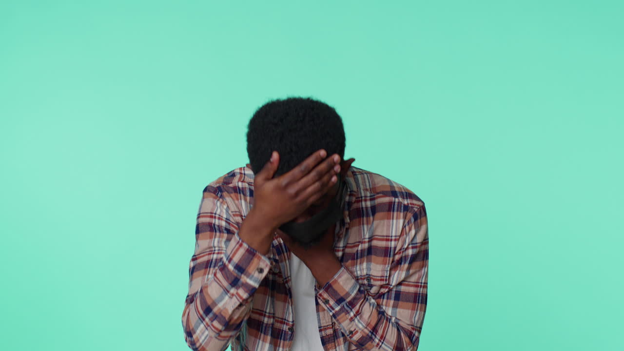 Young man wearing medical mask coughing suffering from bronchitis asthma allergy Coronavirus disease