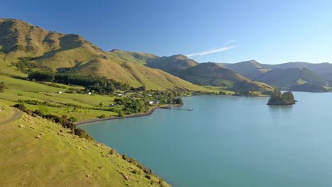 Cinematic-aerial-view-over-Port-Levy,-a-Maori-settlement-on-Banks-Penninsula-in-Canterbury-New-Zealand