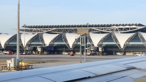 airplane moves past terminal at krabi airport