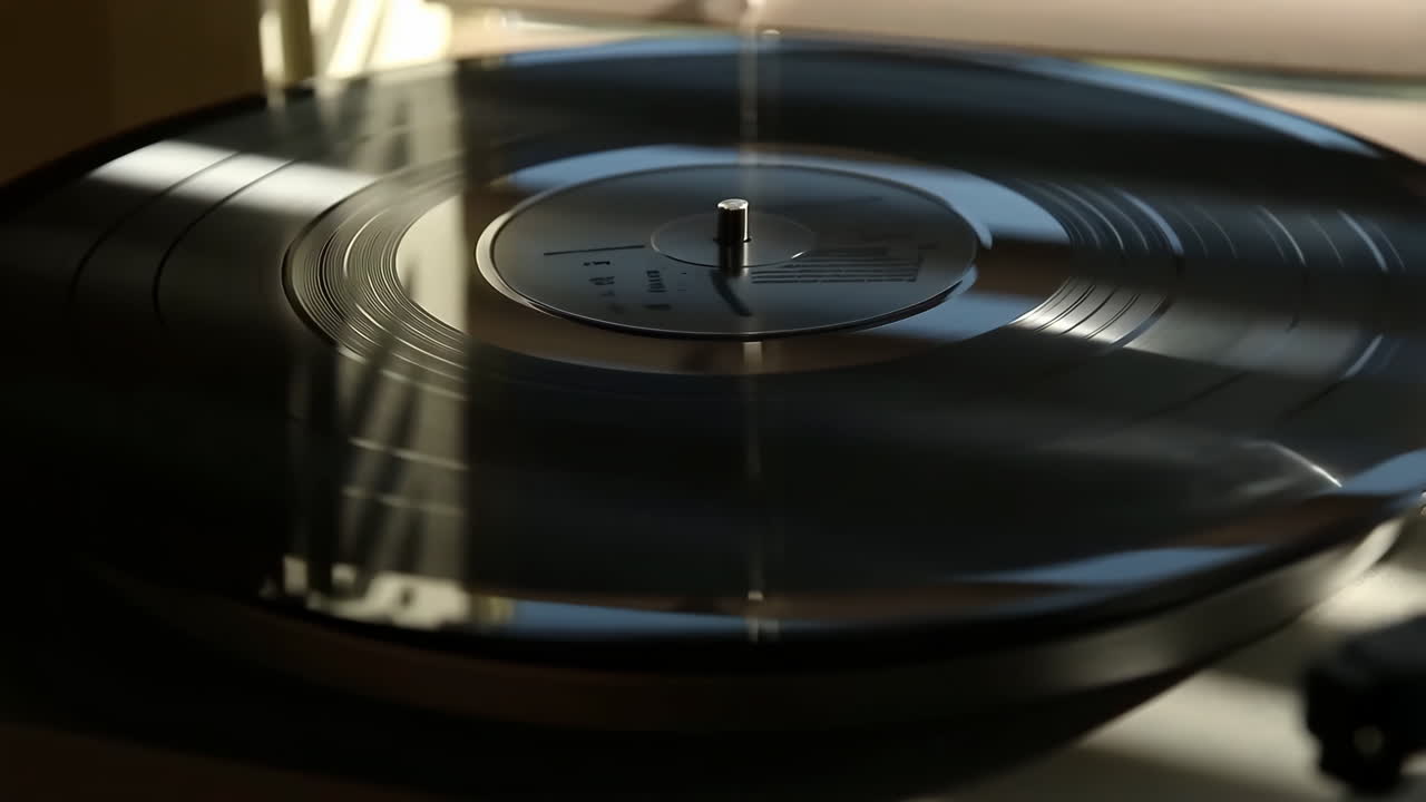 A close-up view of a vinyl record spinning on a turntable
