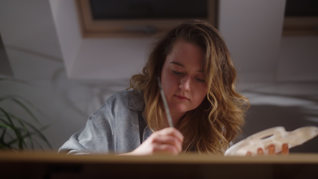 Woman Painting at Home