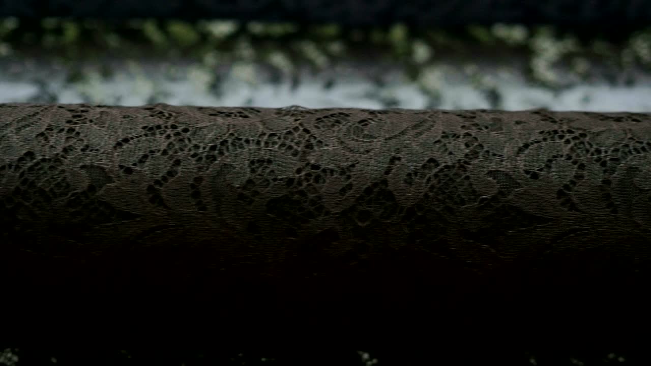 una foto macro de un encaje, tela utilizada para hacer elegantes vestidos de novia para el día de la boda.