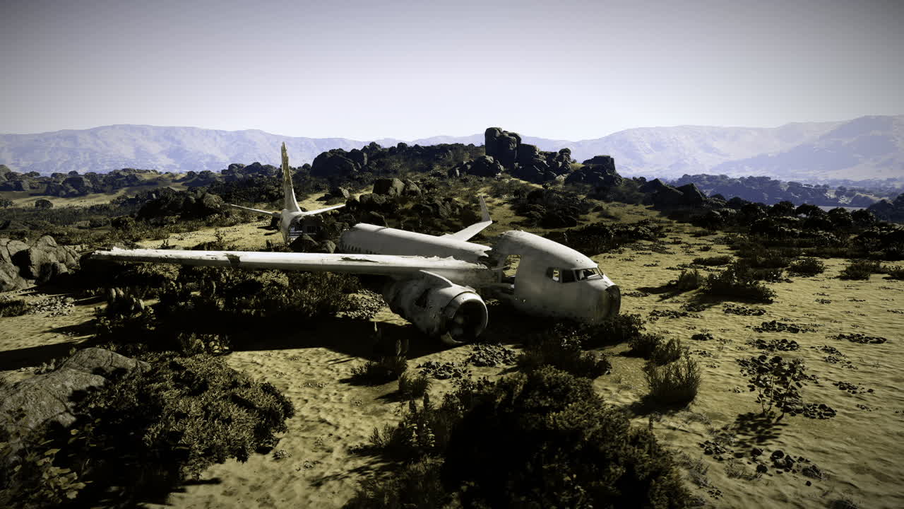 Plane crash site in remote mountainous area with rocky terrain and vegetation