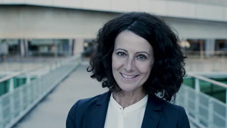 close-up of businesswoman smiling at camera