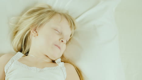 Little-Girl-Sleeping-In-Bed-Top-View-25