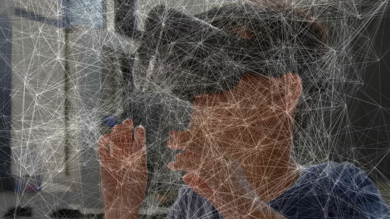 Student inspecting smartphone and slotting into VR headset at desk, exploring animated tech world