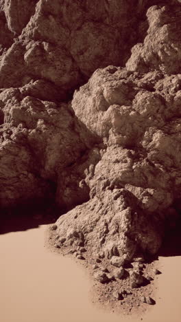 majestic rock formation on sandy beach