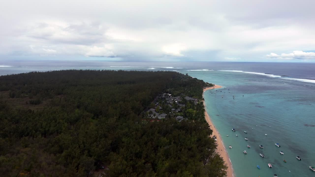 Le Morne Beach on the west coast of Mauritius, featuring stunning turquoise waters and the Le Morne Brabant UNESCO site. Drone footage