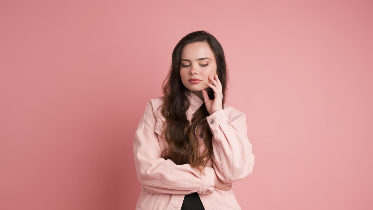 Young woman looking around with thoughtful expression
