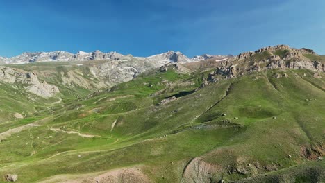 panoramic view of lush green mountains under clear blue sky