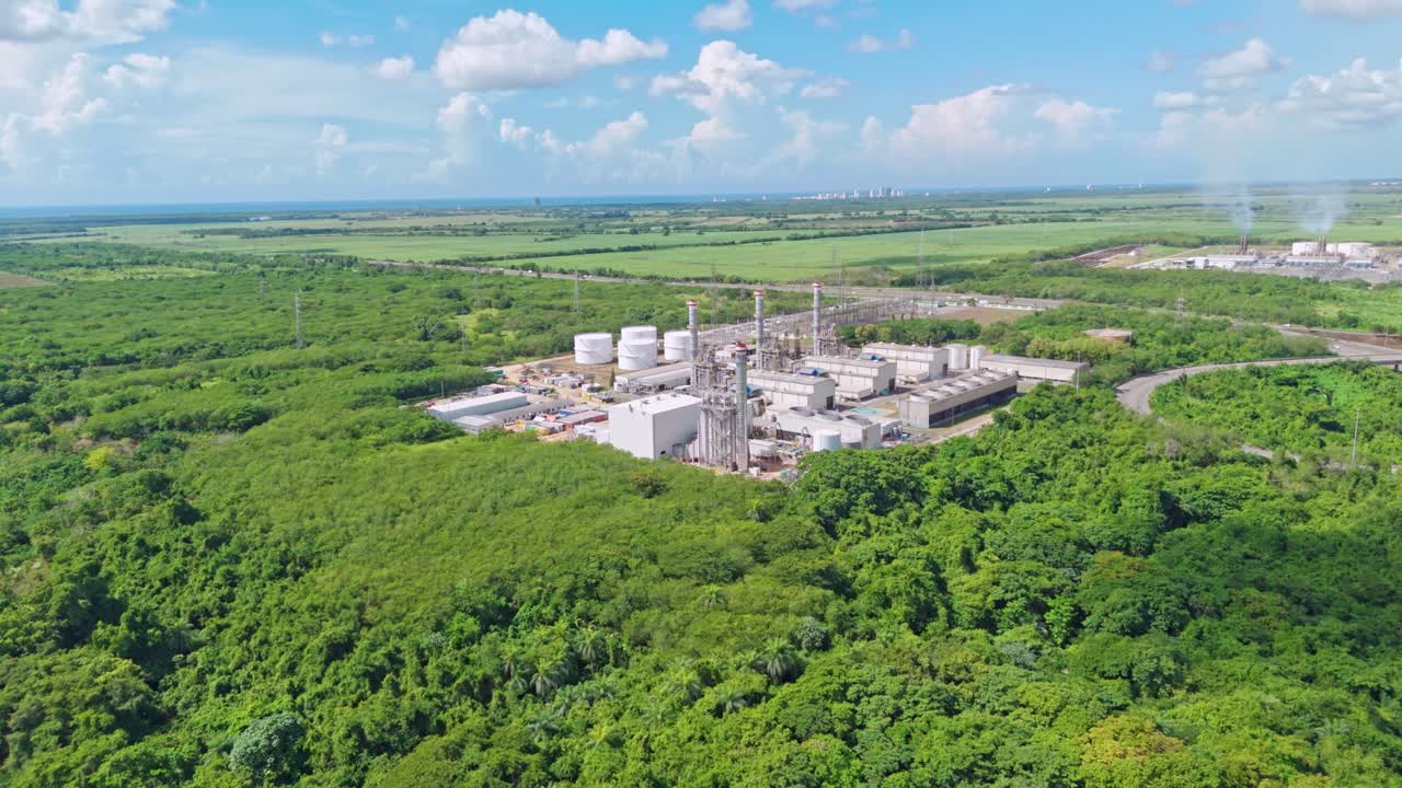Energa 4 power plant surrounded by green fields and forest in San Pedro de Macorís, Dominican Republic