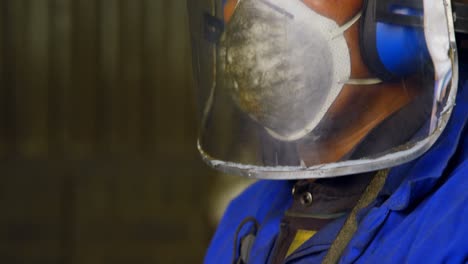 male worker working in workshop 4k