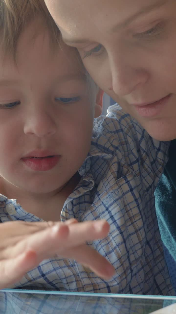 Mother and child using technology