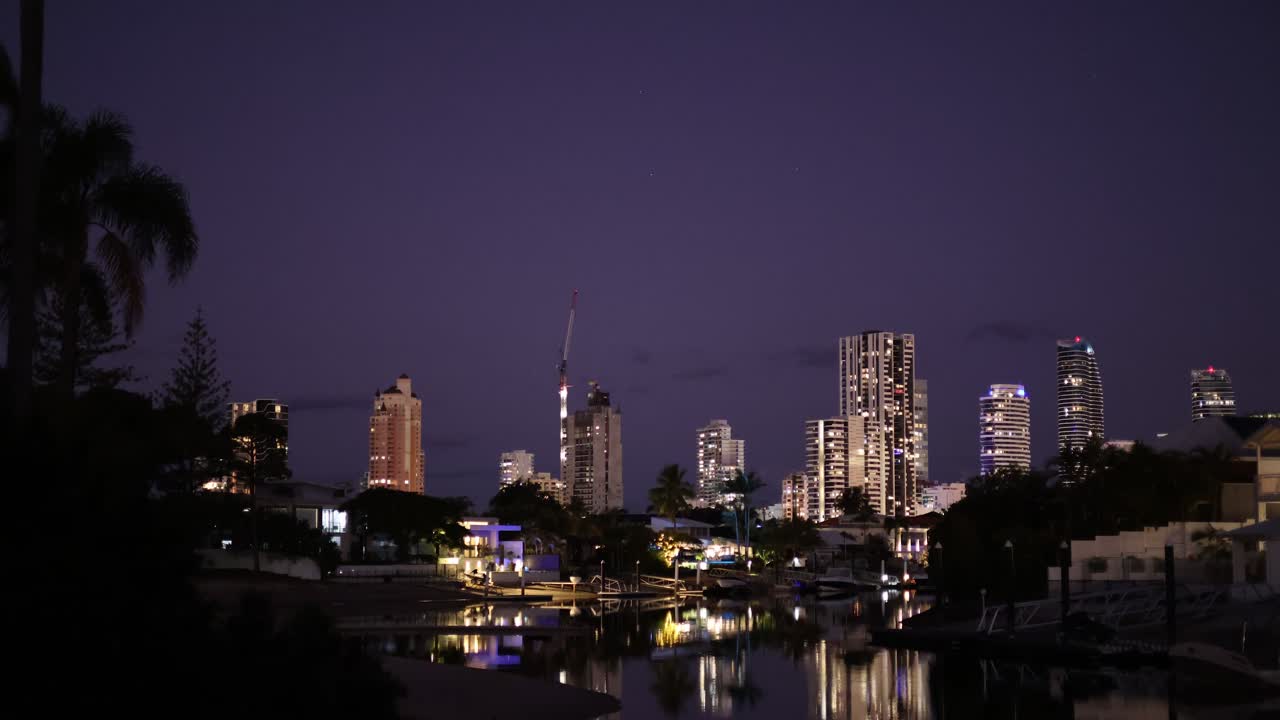 Time-lapse of a city skyline as night falls
