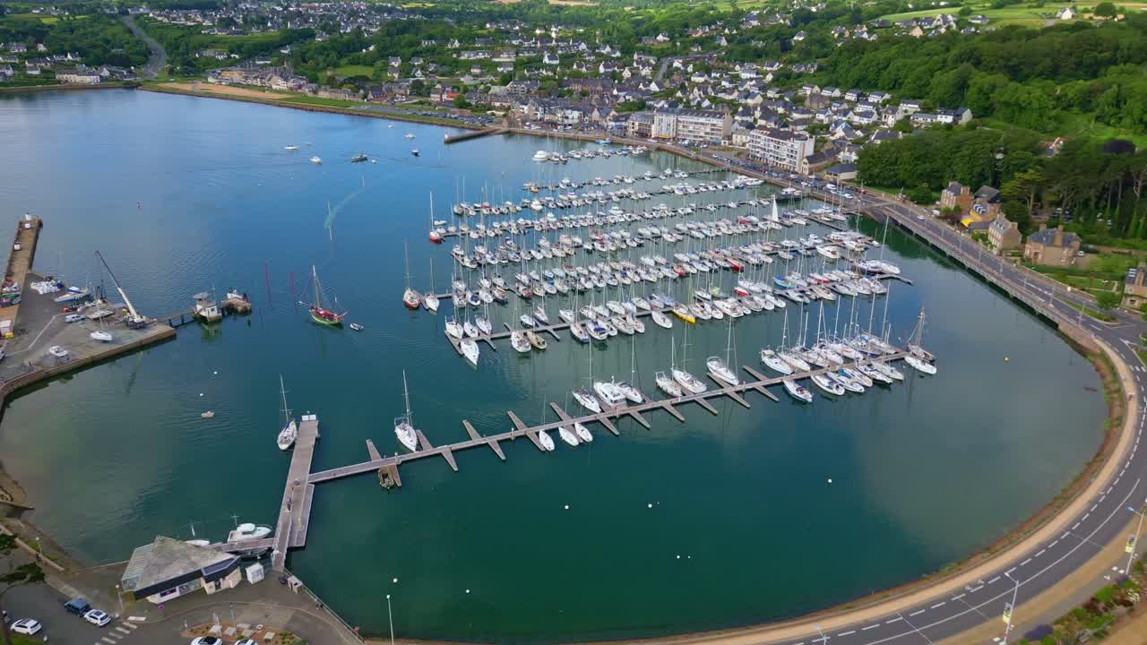 Bird's eye drone view of the marina of Perros-Guirec settlement with docked boats, Brittany, France.