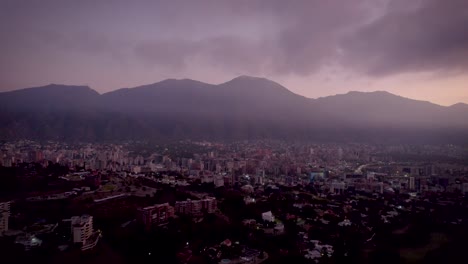 drone view of a sunrise over caracas city, venezuela, with the avila mountain in the background.