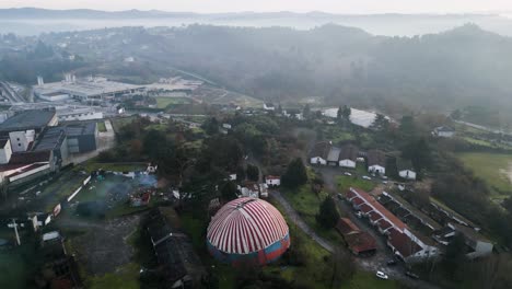 drone dolly above benposta circus tent in ourense spain misty morning