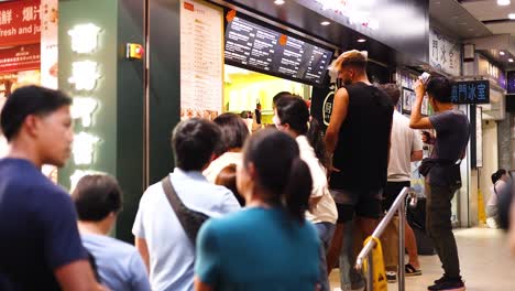 queue at a food kiosk in hong kong