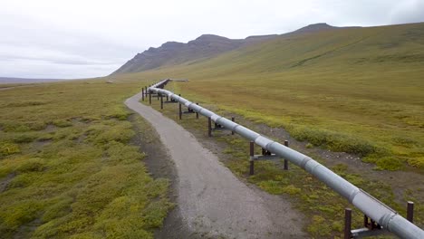 controversial crude oil pipeline in alaska countryside - aerial drone flight