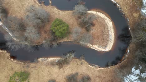 aerial: curves of calm river in national park in lithuania