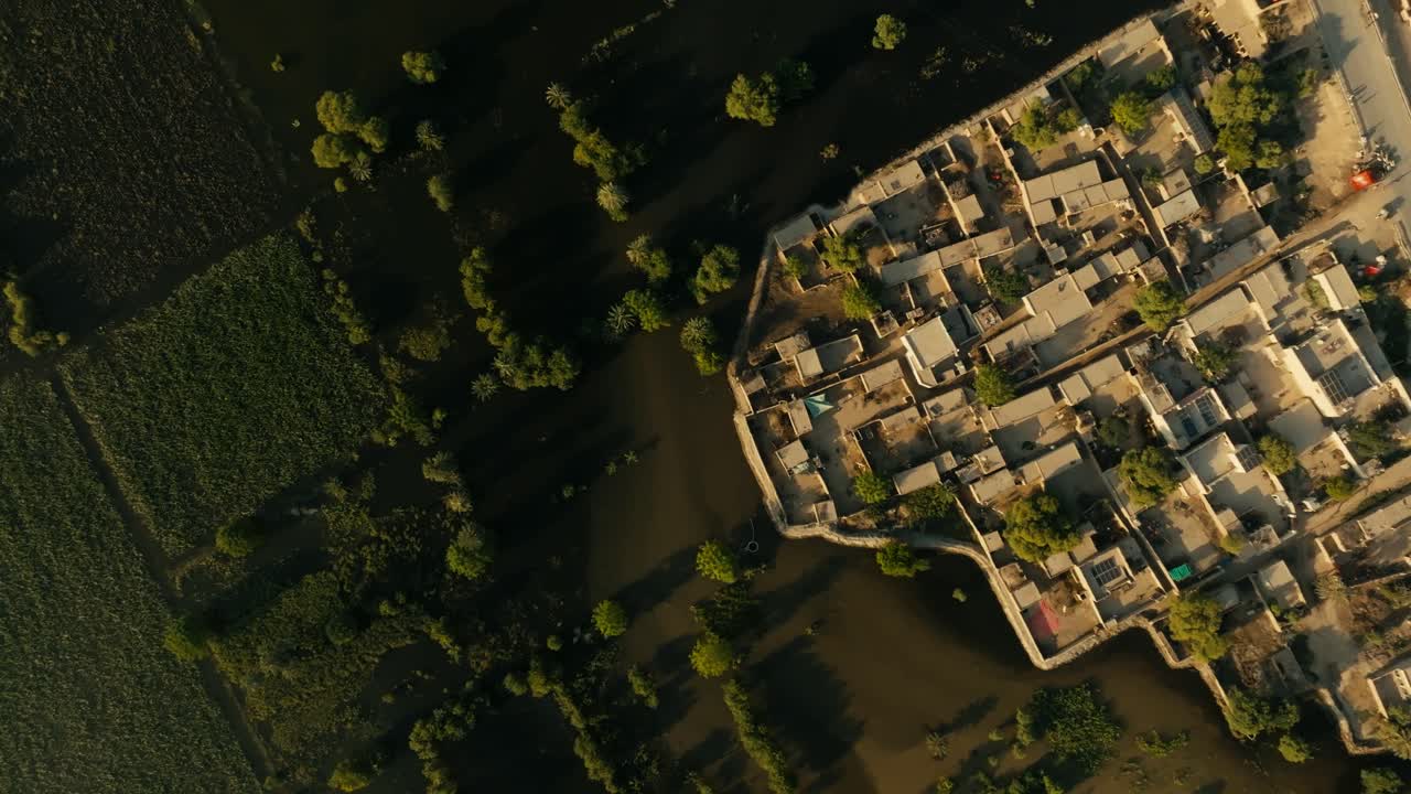 Aerial top view of green fields and forest all destructed by heavy flood in Punjab, Pakistan