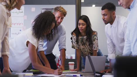 professional businesspeople discussing together in modern office in slow motion