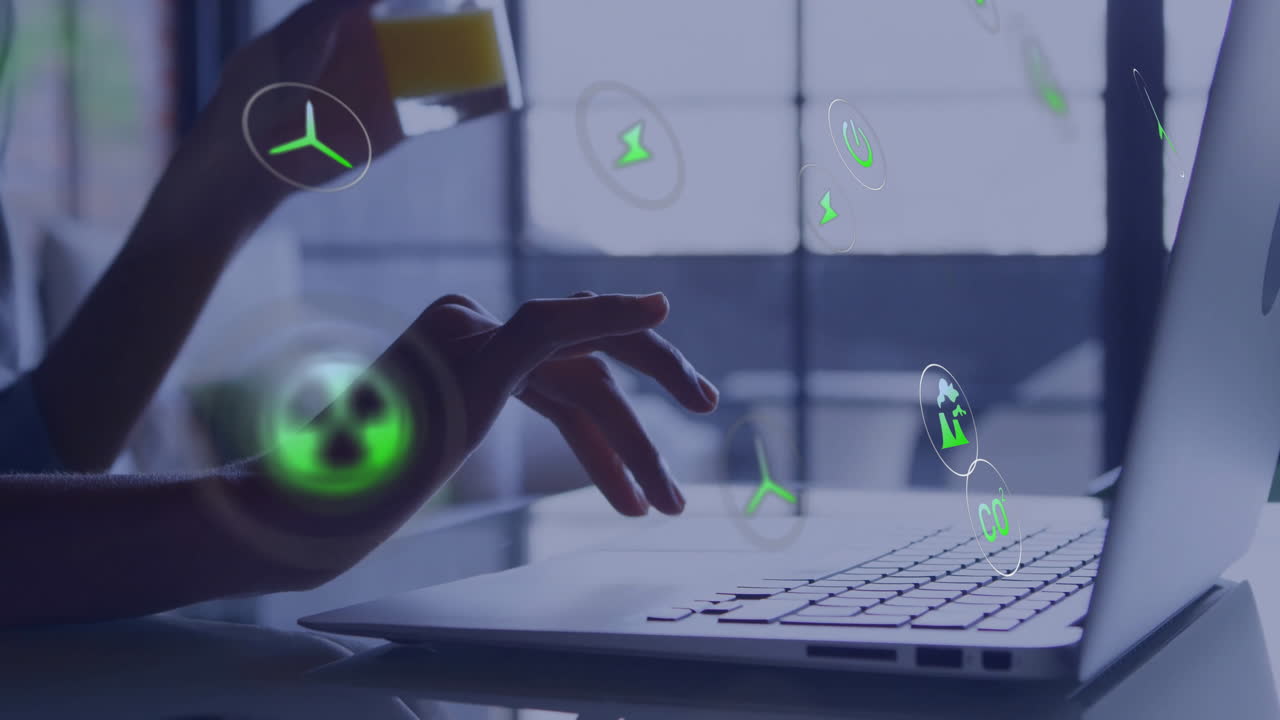 Typing on laptop, hands interacting with green energy animation in office
