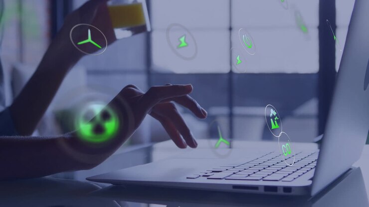 Typing on laptop, hands interacting with green energy animation in office