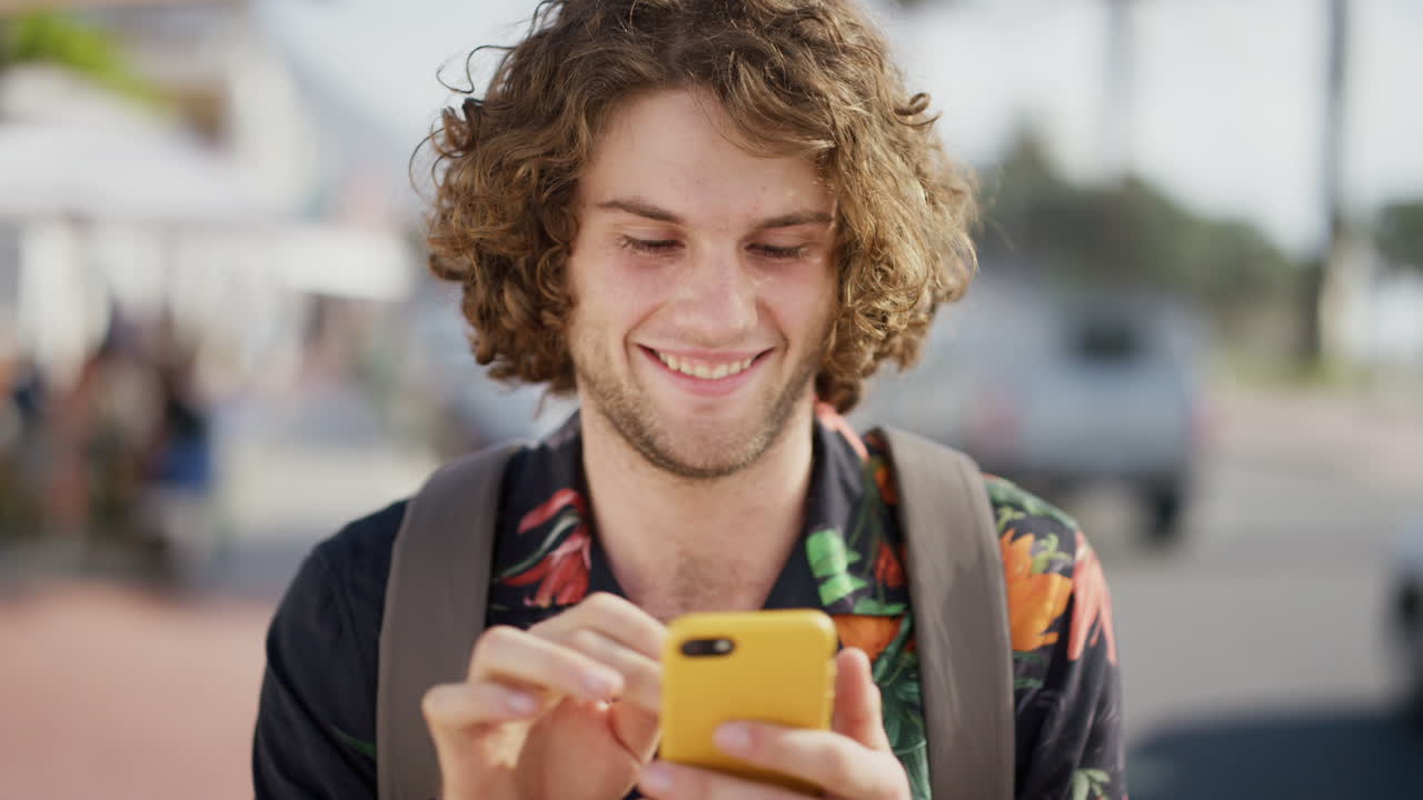 Happy man, phone and communication on city street