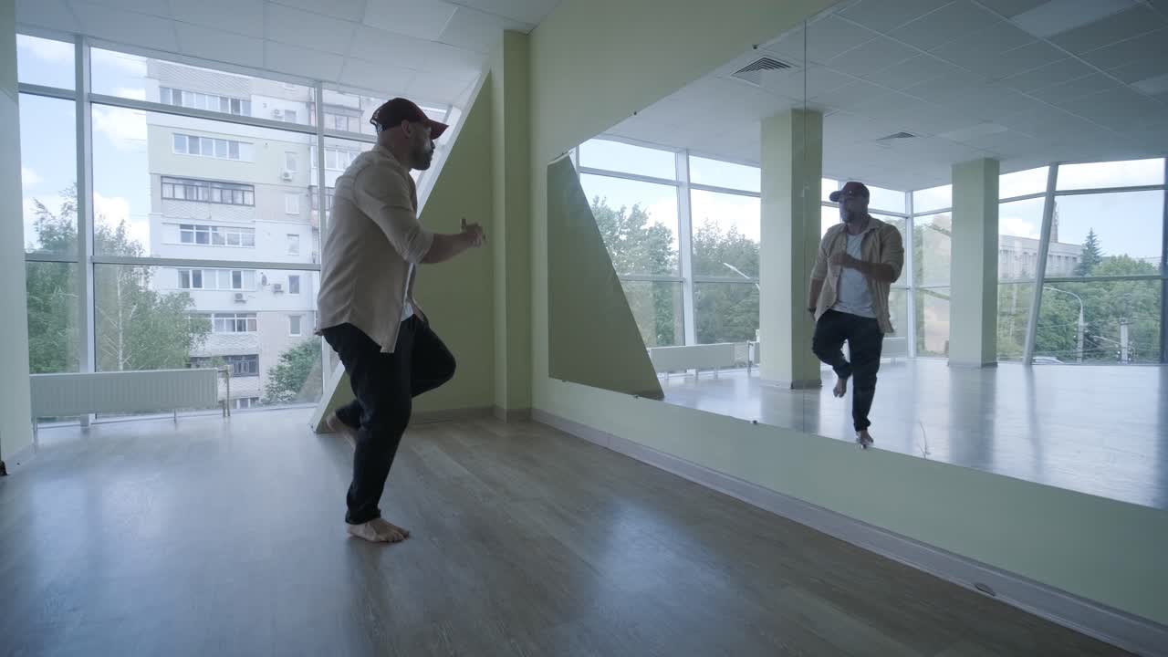 Man Breakdancing in Modern Studio