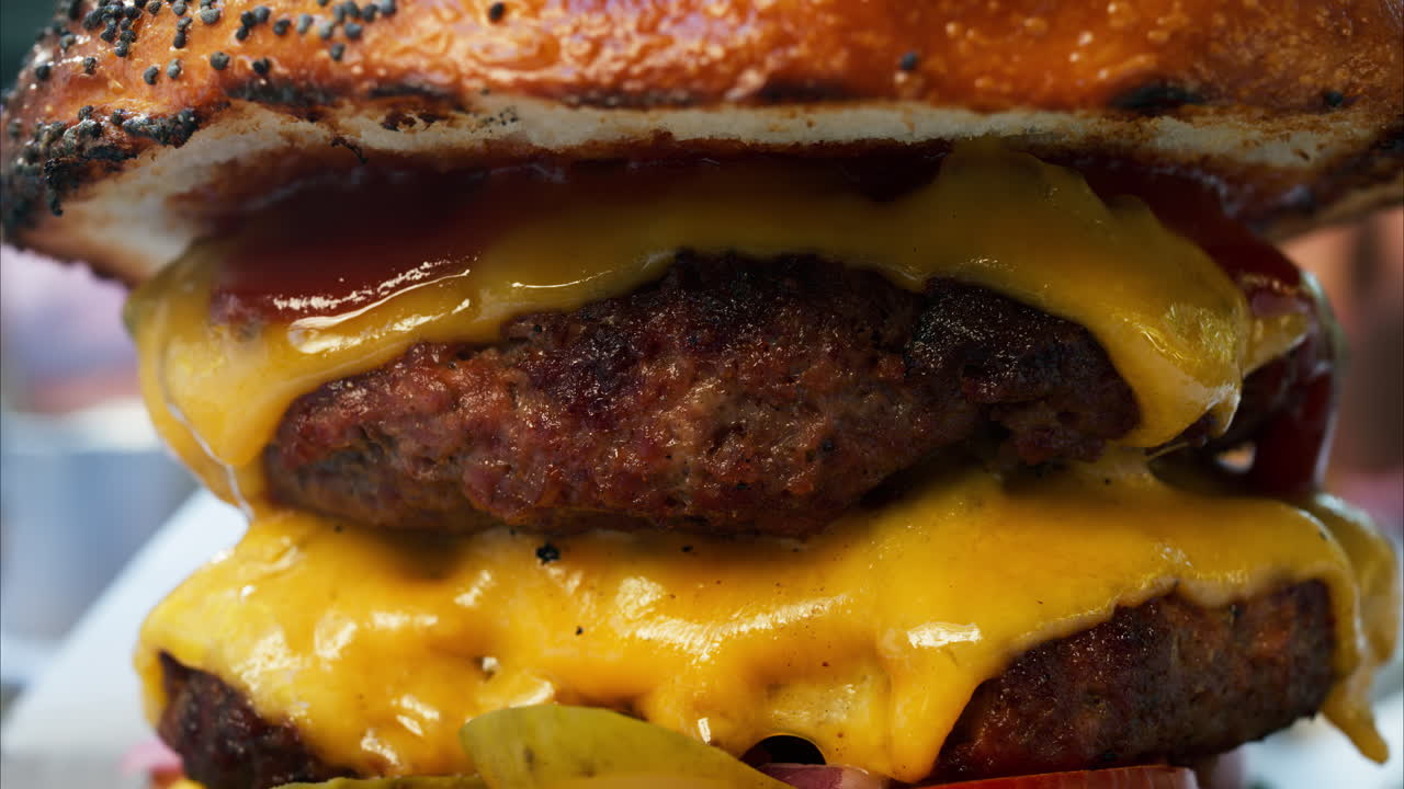 Close up of a big hamburger on a table at a restaurant