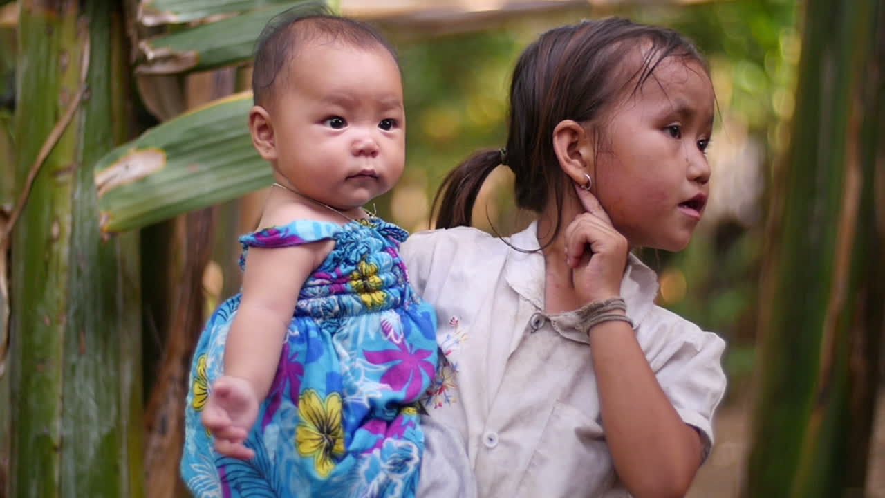 Sister Holding Baby Sister