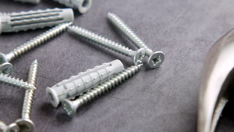 close-up of screws and plastic anchors