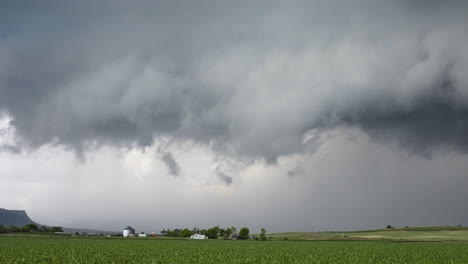 stormy skies drifting across peaceful farmland time lapse