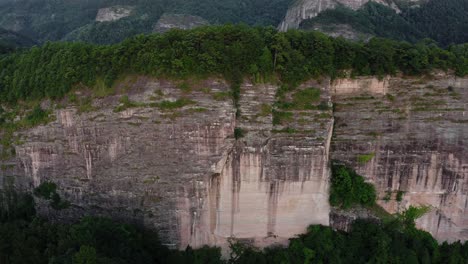 dramatic mountain cliff, bajiao shan mountain precipice in china, 4k aerial