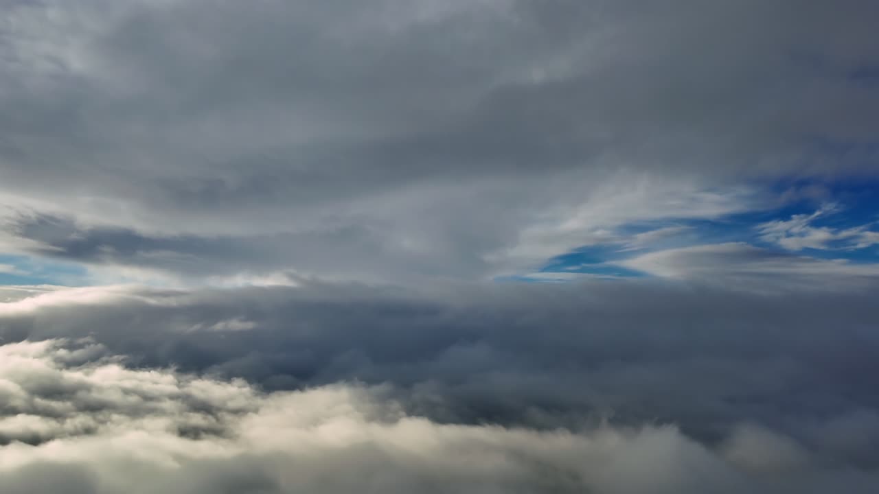 An immersive dreamlike cloudscape recorded from a jet cockpit flying at supersonic speed between endless layers of ethereal straus clouds illuminated by the sunset difuse light. Ultra-realistic 4K