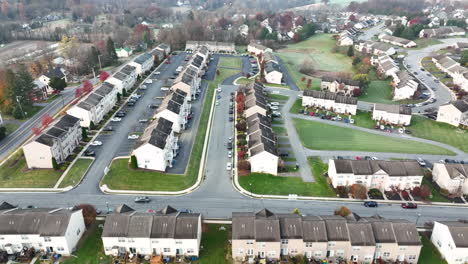 Aerial-truck-shot-of-townhouse-homes-in-USA-neighborhood-in-barren-autumn-fall-landscape