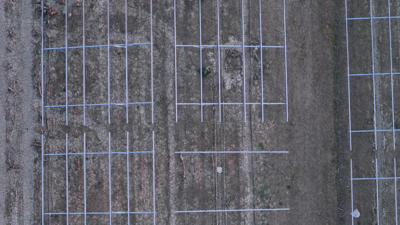 Building photovoltaic solar panels farm structure on agricultural land, demonstrating renewable energy development, clean energy production, and green technology investment