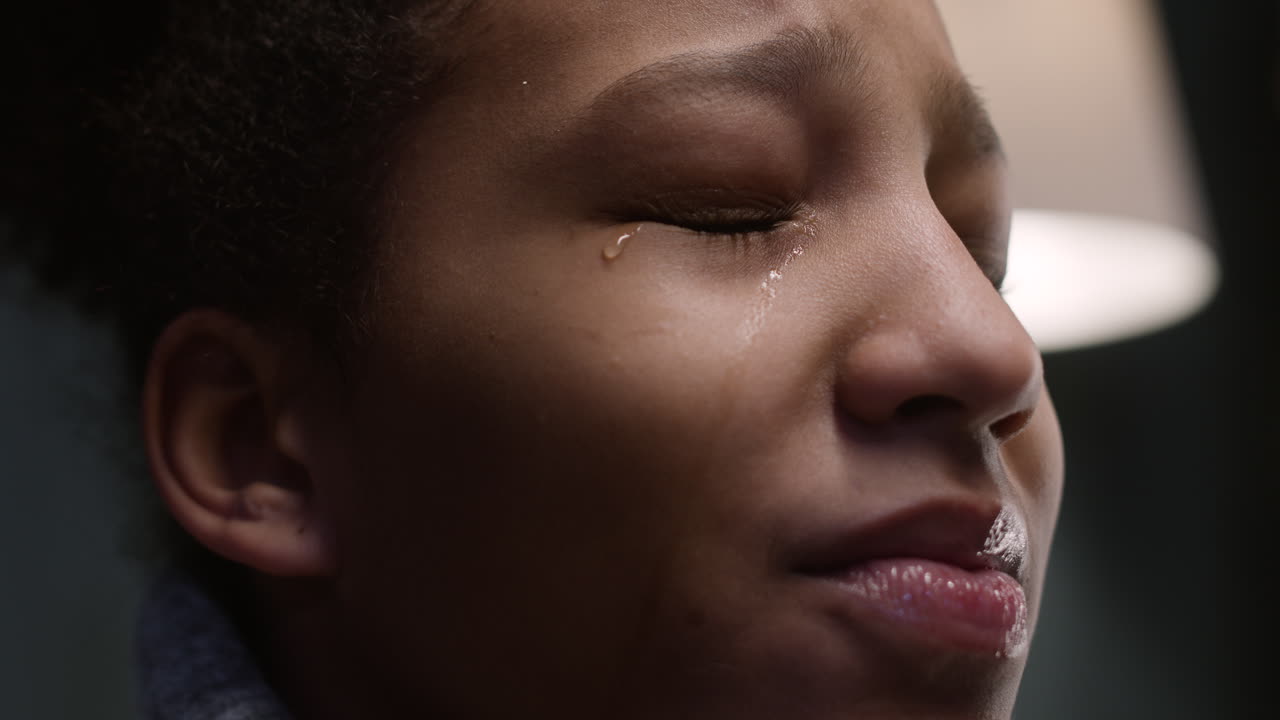 Unhappy girl looking up in her bedroom