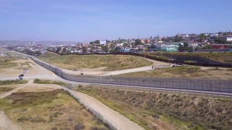 an aerial over the border wall fence separating the us from mexico and san diego from tijuana 4