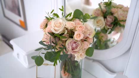 Orbiting-shot-Wedding-bouquet-on-glass-jar,-beautiful-flower-arranjement,-Closeup