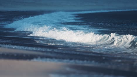 the powerful waves roll on the sandy shallows on the ersfjord beach