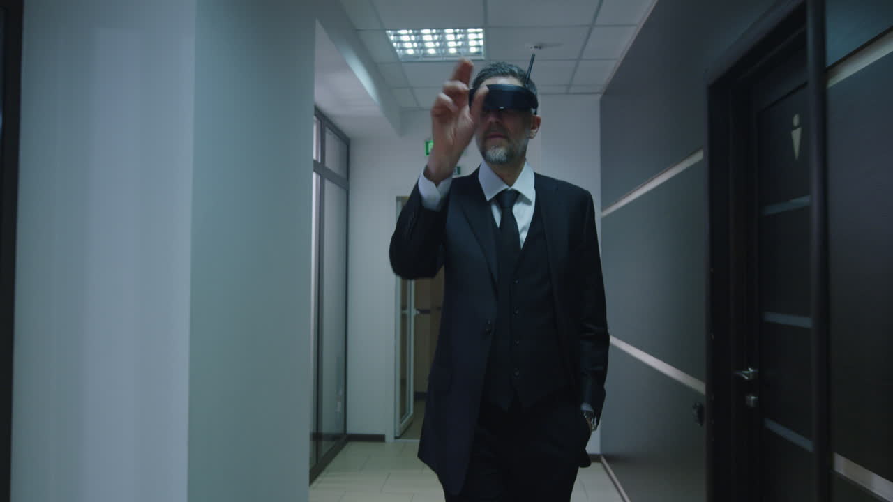 Businessman wearing VR headset in office corridor
